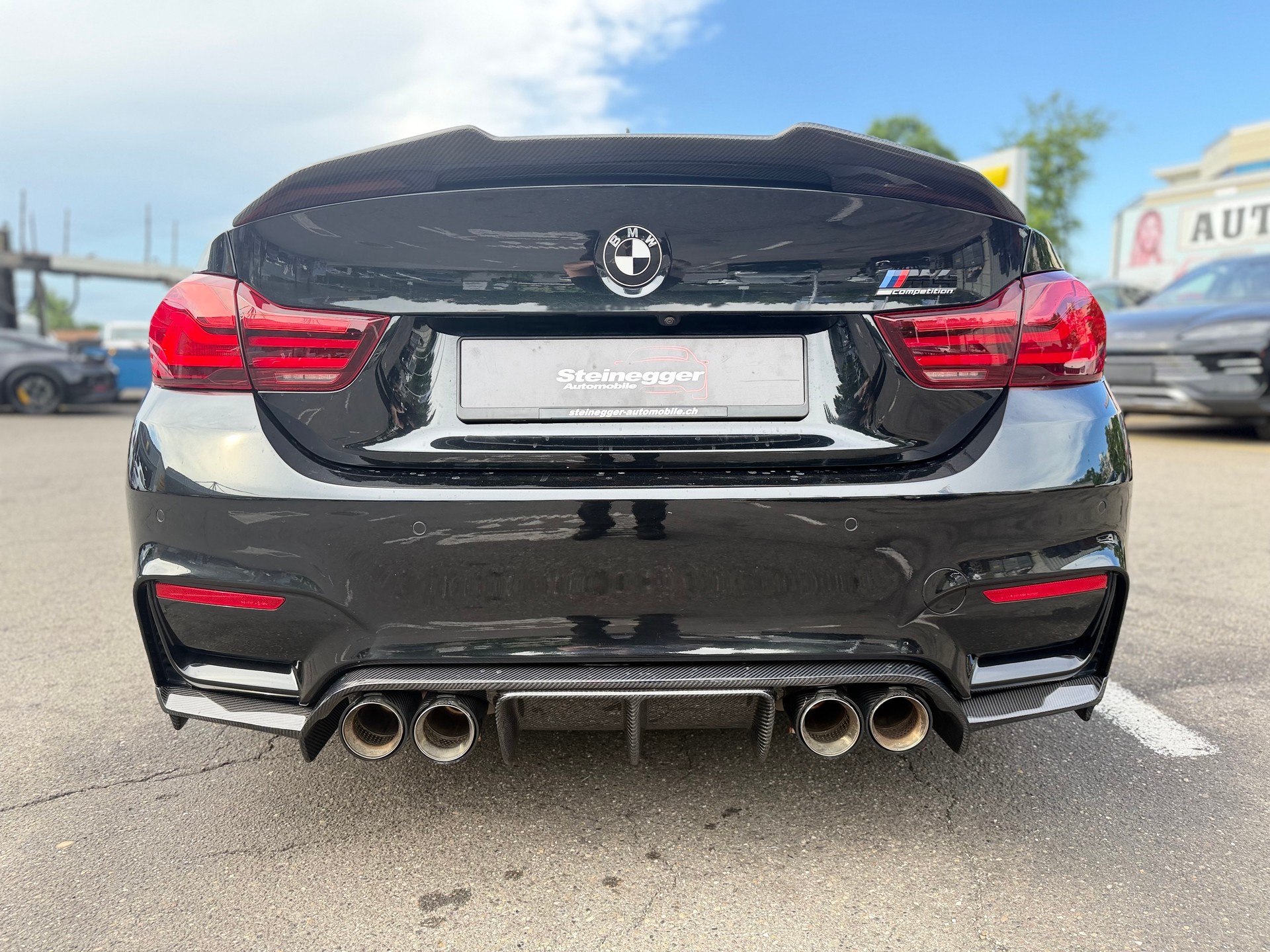 BMW M4 Coupé Competition DKG ° All Black + Carbon °-image-9