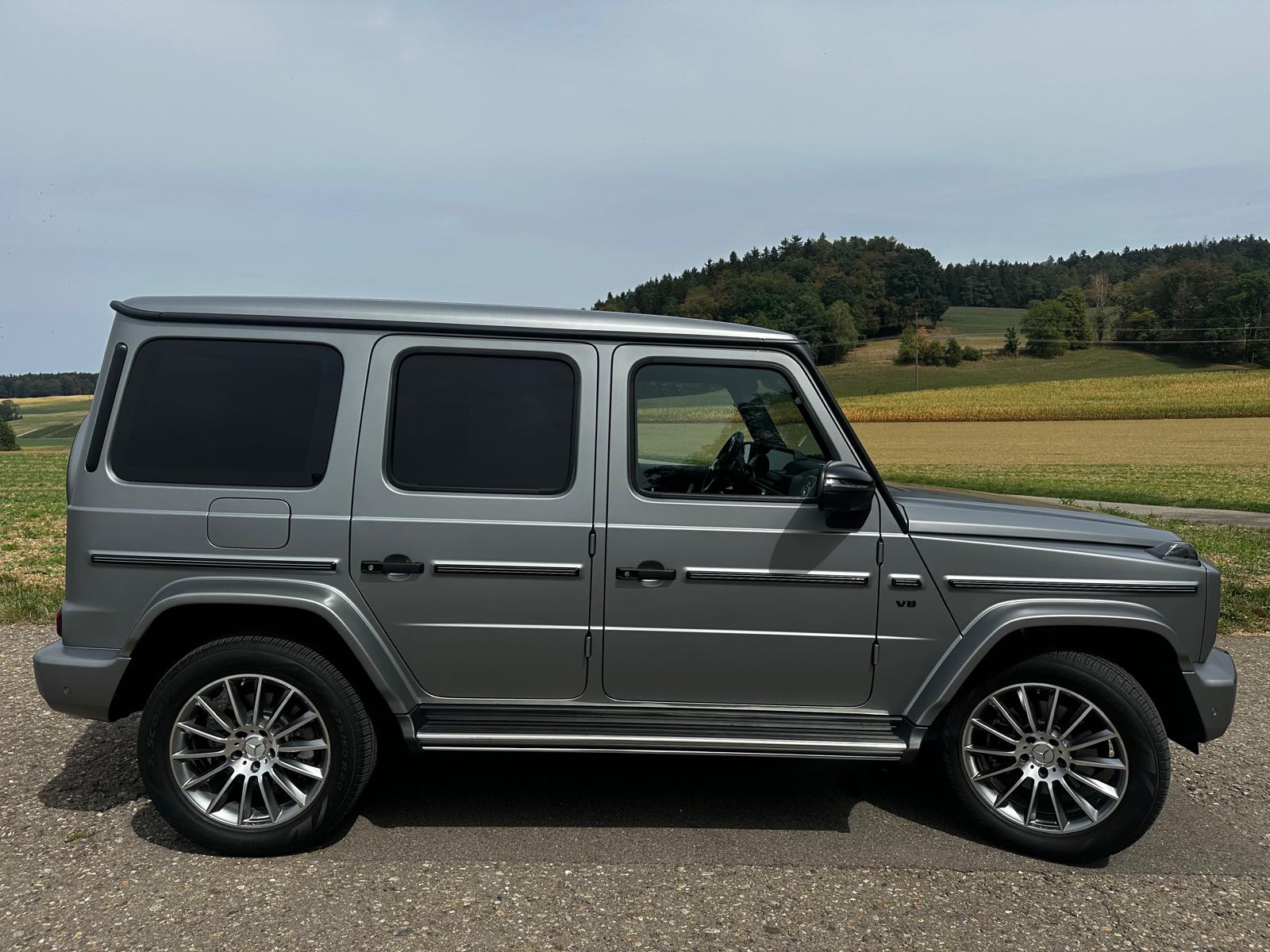 MERCEDES-BENZ MERCEDES-BENZ G 500 AMG Line 9G-Tronic – designo platin magno, 14'261 km, 1. Hand. 10 Jahre gratis Service - 100'000KM-image-1