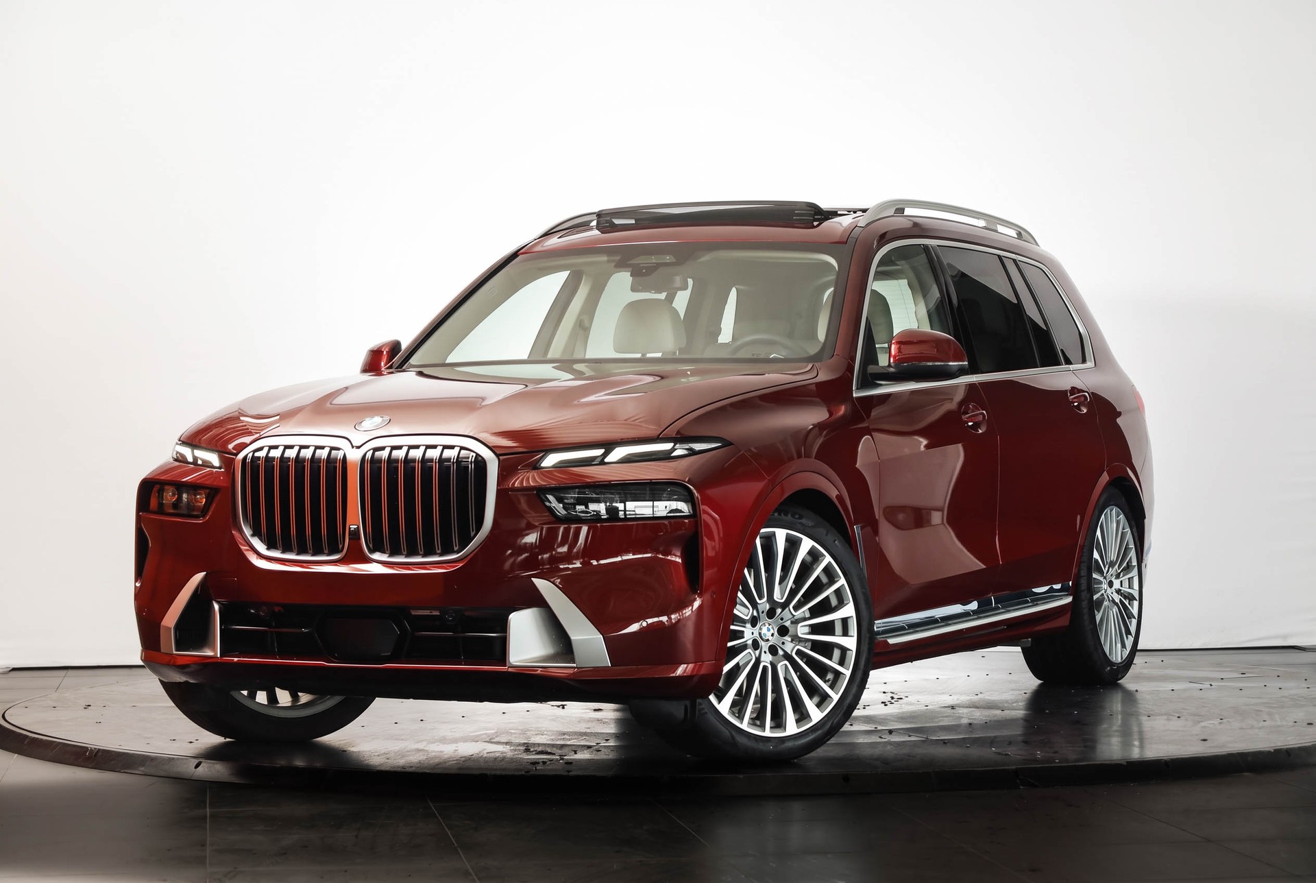 BMW X7 xDrive 48V 40d • Aventurinrot III • Individual Merino Elfenbeinweiss • Véhicule suisse-image-4